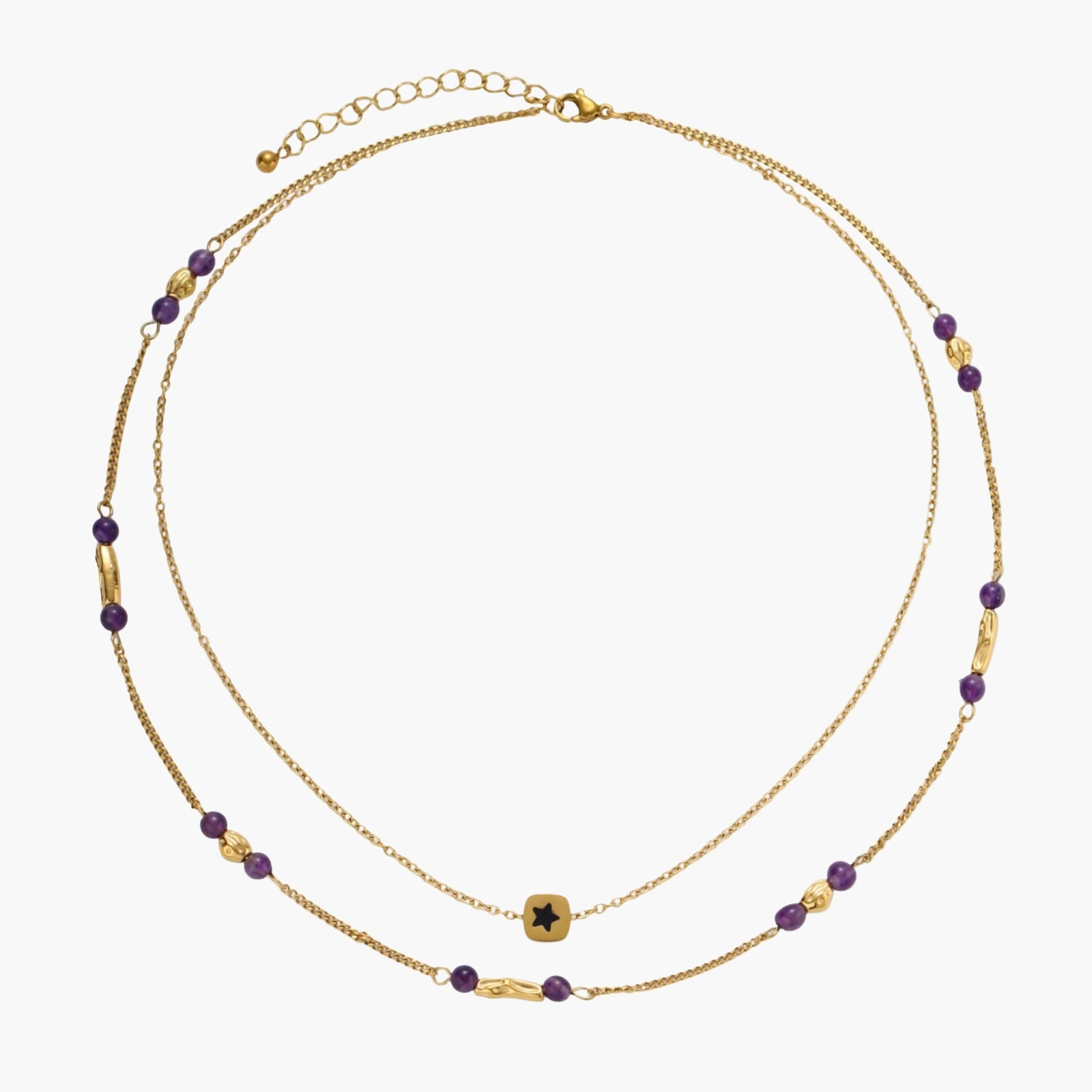 Two layered gold-tone necklaces with purple stone beads and star pendant against cream background.