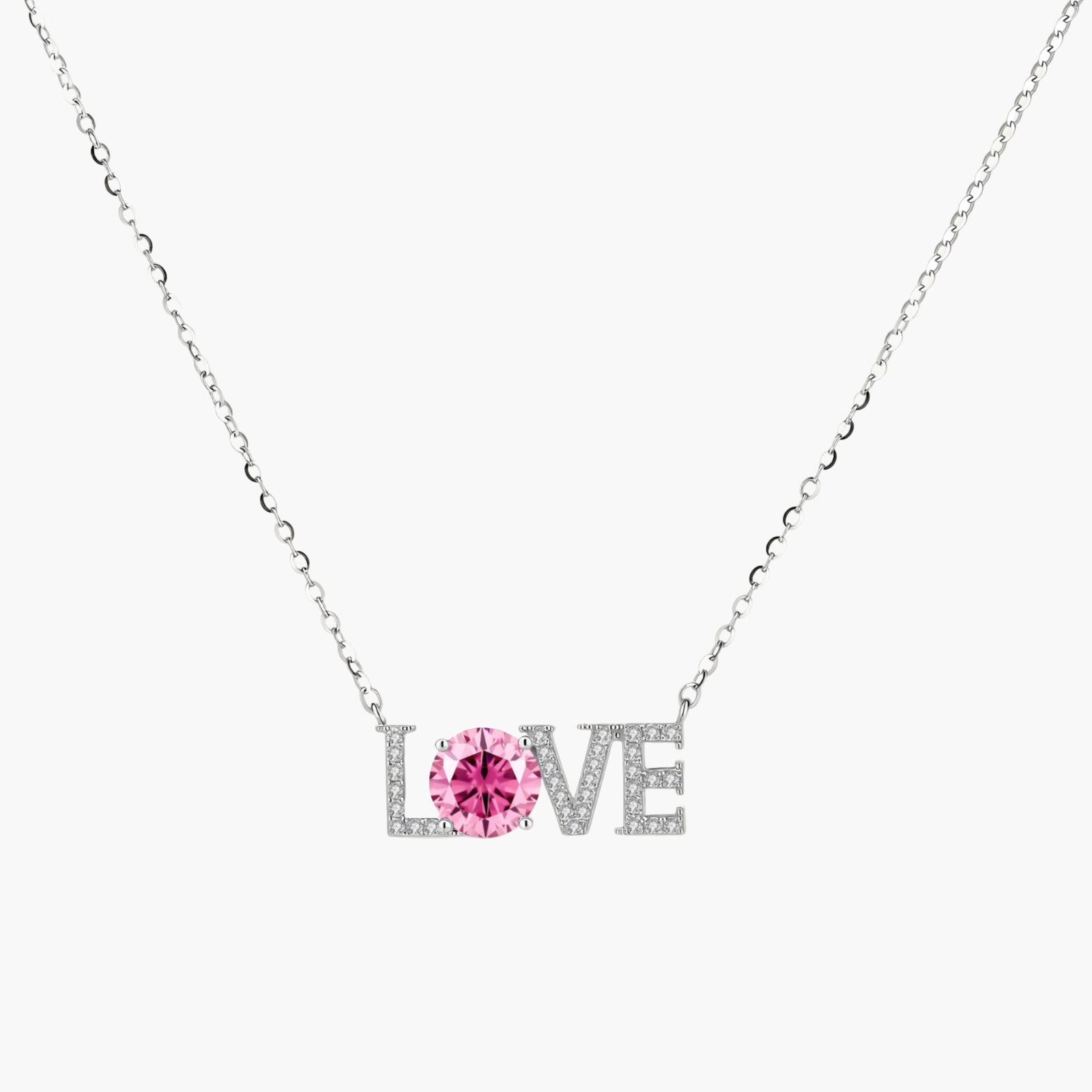 Sterling silver LOVE necklace with pink moissanite stone replacing the O, featuring crystal-set letters on delicate chain.