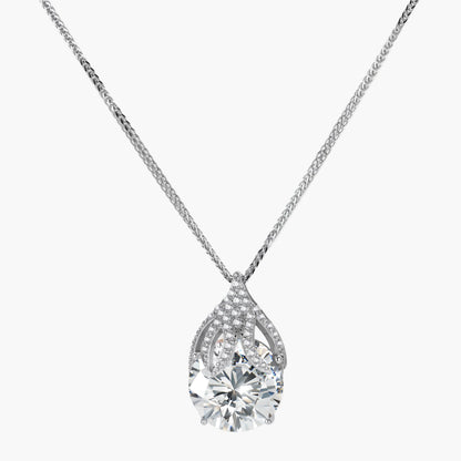 Sterling silver necklace featuring a large pear-shaped moissanite stone in an ornate setting with smaller accent stones