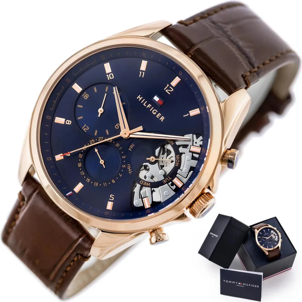 Tommy Hilfiger Baker Herrenuhr 1710453 | Teilskelettiert Blau | Roségoldenes Gehäuse & Braunes Lederarmband