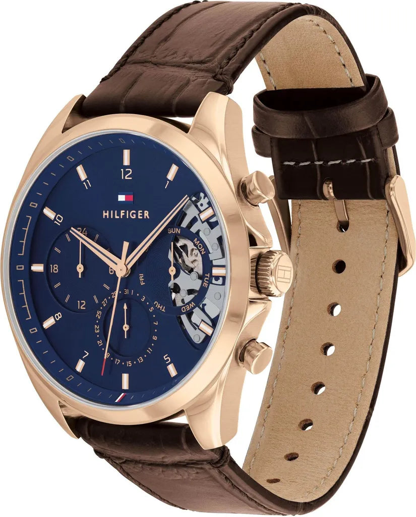 Tommy Hilfiger Baker Herrenuhr 1710453 | Teilskelettiert Blau | Roségoldenes Gehäuse & Braunes Lederarmband